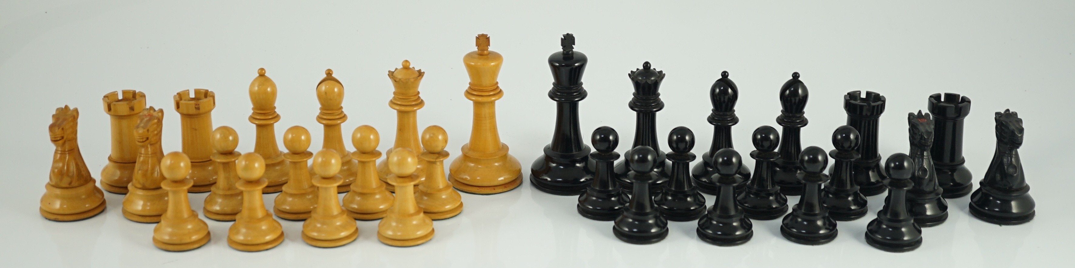 A Jaques & Son Staunton pattern ebony and boxwood chess set, Kings 9.5cm